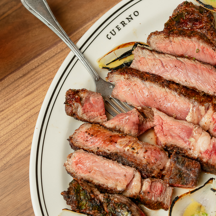 Fire-grilled steak at Cuerno Mexican steakhouse in New York City Fire-grilled steak at Cuerno Mexican steakhouse in New York City